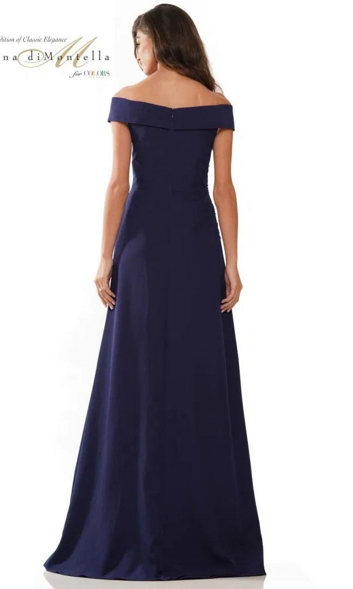 A woman models the Rina Di Montella RD2806 long formal dress, standing with her back to the camera against a plain white background.